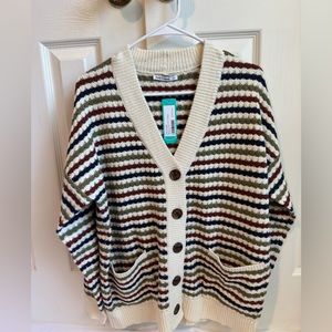 A green, white, blue, and Orange stripped sweat. Perfect for the fall and winter